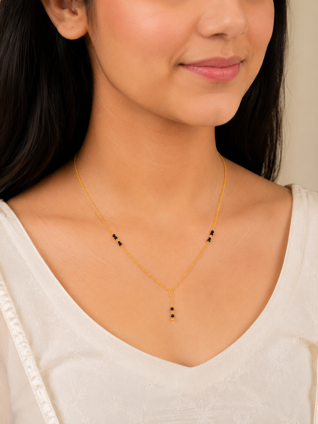 Elegant Dual Bead Short Gold Mangalsutra with Graceful Drop Pendant Design
